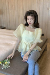 Camisa de manga corta con diseño de lazo en la espalda